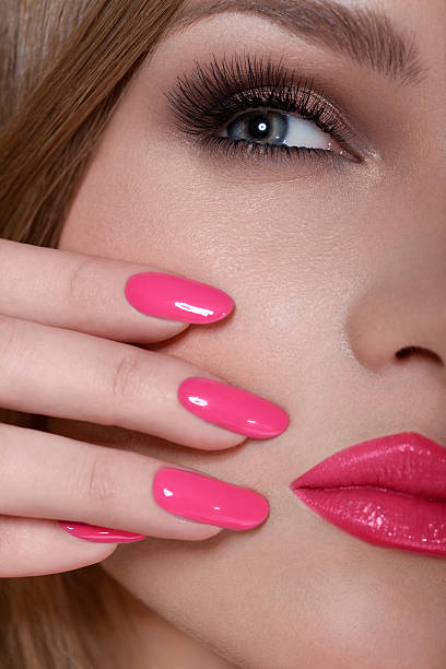 istock Manicure and Makeup. Beautiful Woman With Pink Nails 487852725