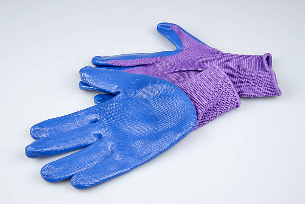 istock Women's gardening gloves on a white background 487853461