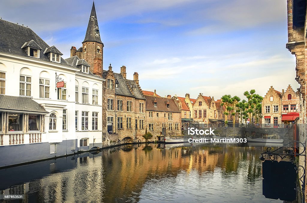 Famous water canal with colorful houses and boats in Bruges Famous water canal with colorful houses and boats in Bruges, Belgium Architecture Stock Photo