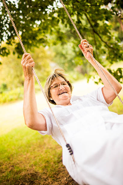 istock Senior Woman in swing 487853631