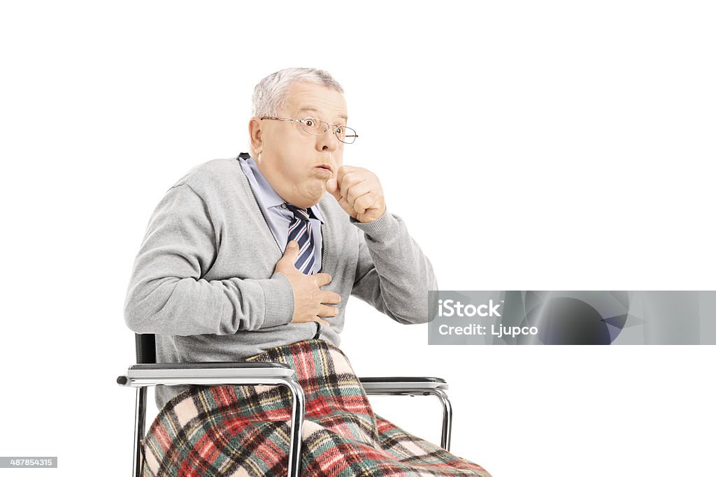 Senior man in wheelchair, choking Senior man in wheelchair choking isolated on white background Choking Stock Photo