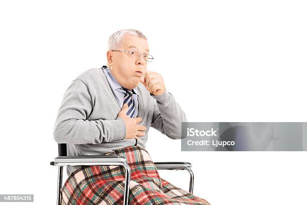 Senior Man In Wheelchair Choking Stock Photo - Download Image Now - Choking, Wheelchair, 60-69 Years