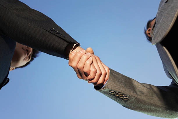 istock Closeup Of Business Handshake 487854915
