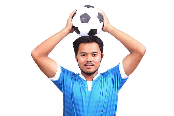 istock Young soccer football player on white 487855351