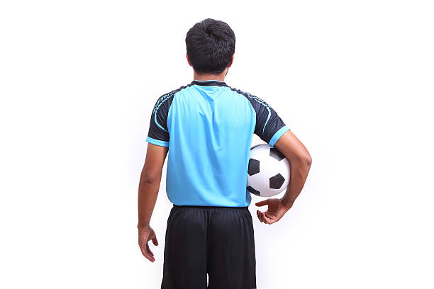 istock Young soccer football player on white 487855353