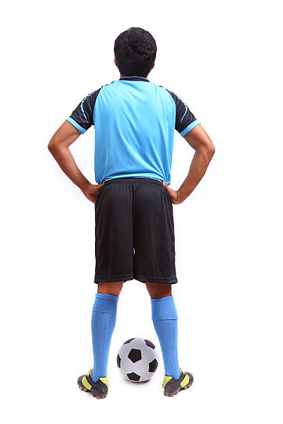 istock Young soccer football player on white 487855355