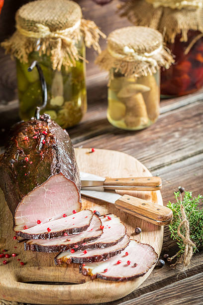 istock Tasting fresh piece of ham in a smokehouse 487855377
