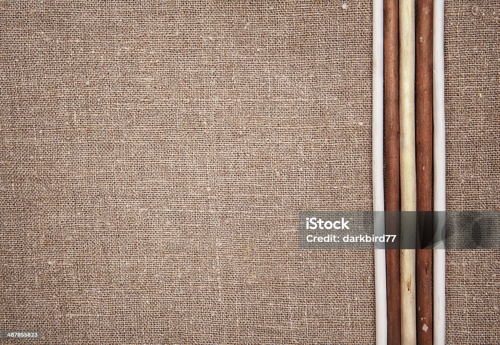 Burlap linen with wooden sticks Burlap linen background with five wooden sticks Blank Stock Photo