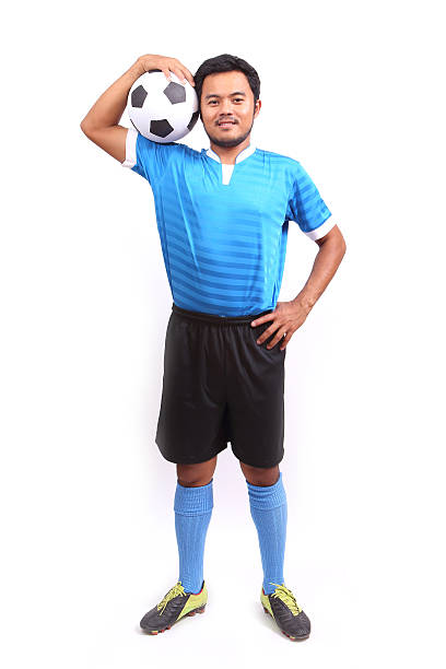 istock Young soccer football player on white 487856213
