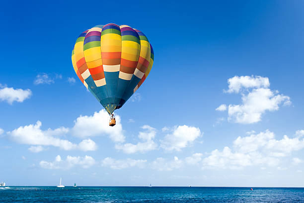 istock Colorful hot air balloon over the sea 487856587