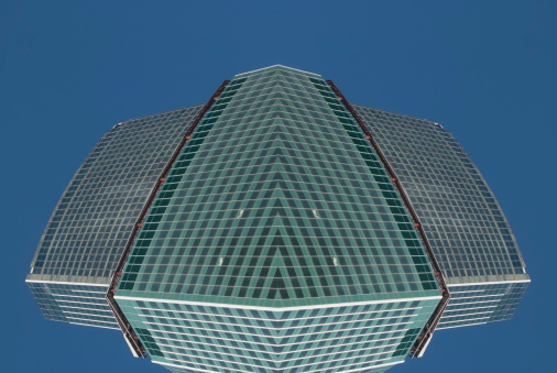 digitally transformed photo of modern office building. Business background.