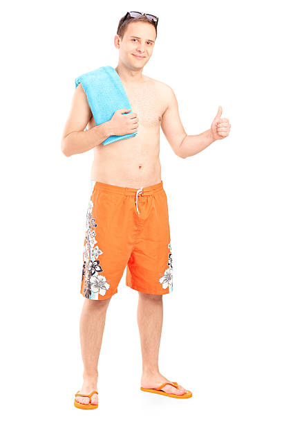 istock Man in swimsuit giving thumb up 487857767