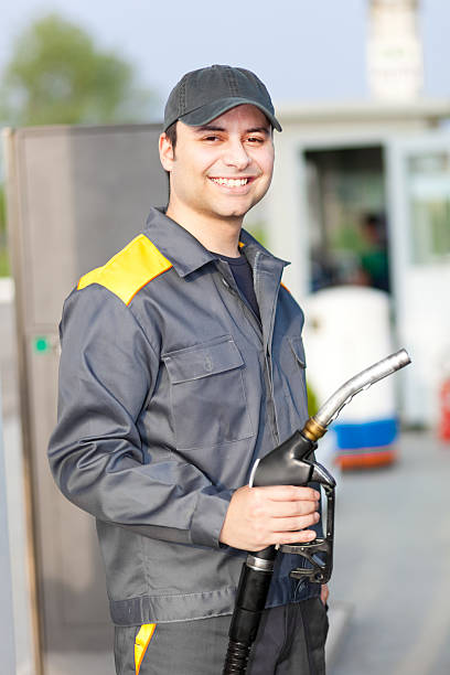 Smiling gas station worker stock photo