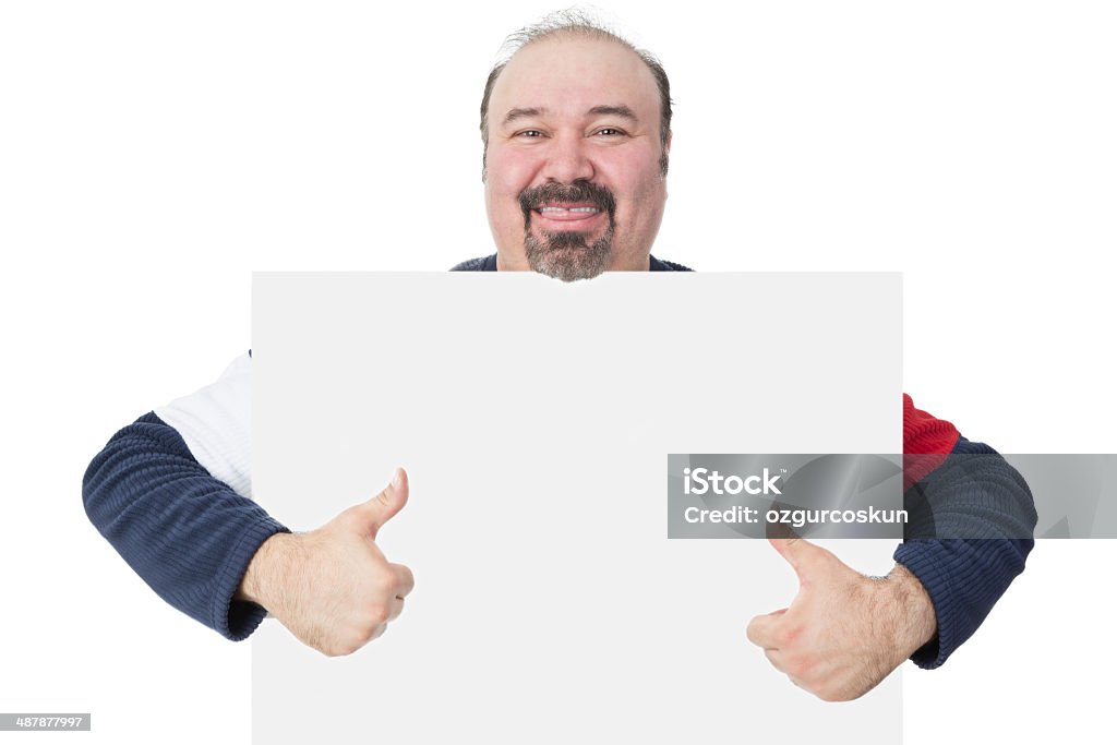 Man holding a blank board giving a thumbs up Happy smiling middle-aged man with a goatee holding a blank white board with copyspace for your text giving a thumbs up gesture of approval Hope - Concept Stock Photo