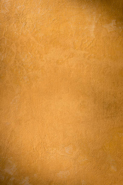 istock Ocher yellow Roman wall texture background, Rome Italy 487878745