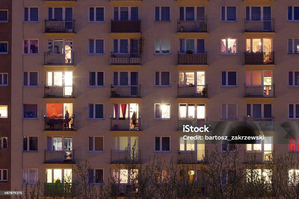 window of an apartment block at night Apartment Stock Photo