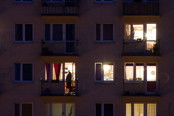 istock window of an apartment block at night 487879343