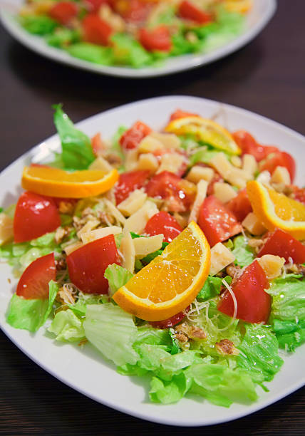 istock salad with chicken, tomato, orange and parmesan 487879807