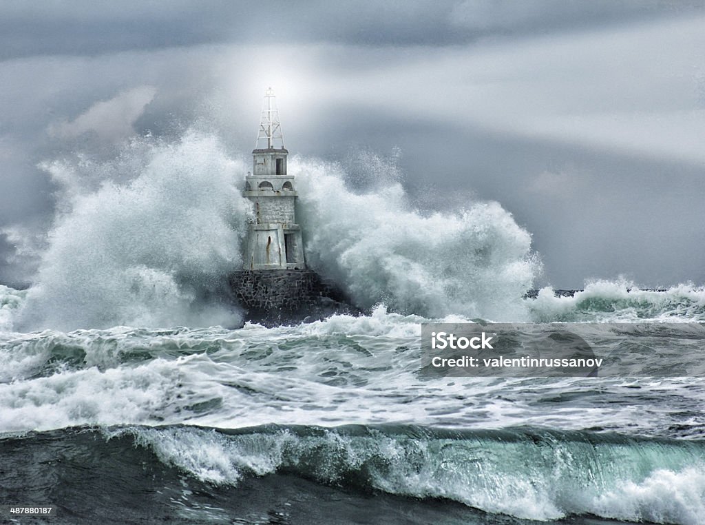 Lighthouse and storm Lighthouse and storm - THE GRAIN AND TEXTURE ADDED Lighthouse Stock Photo