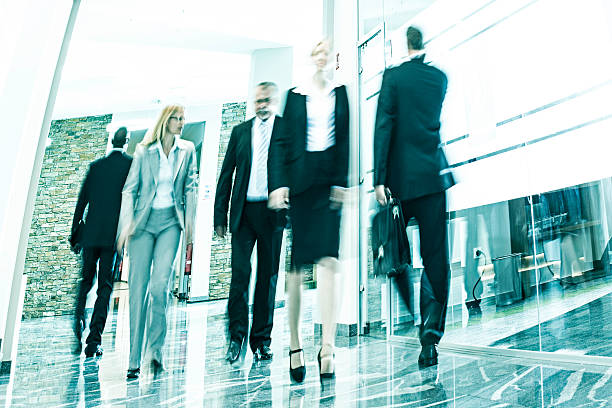 istock Businesspeople Walking in a Modern Interior 487880503