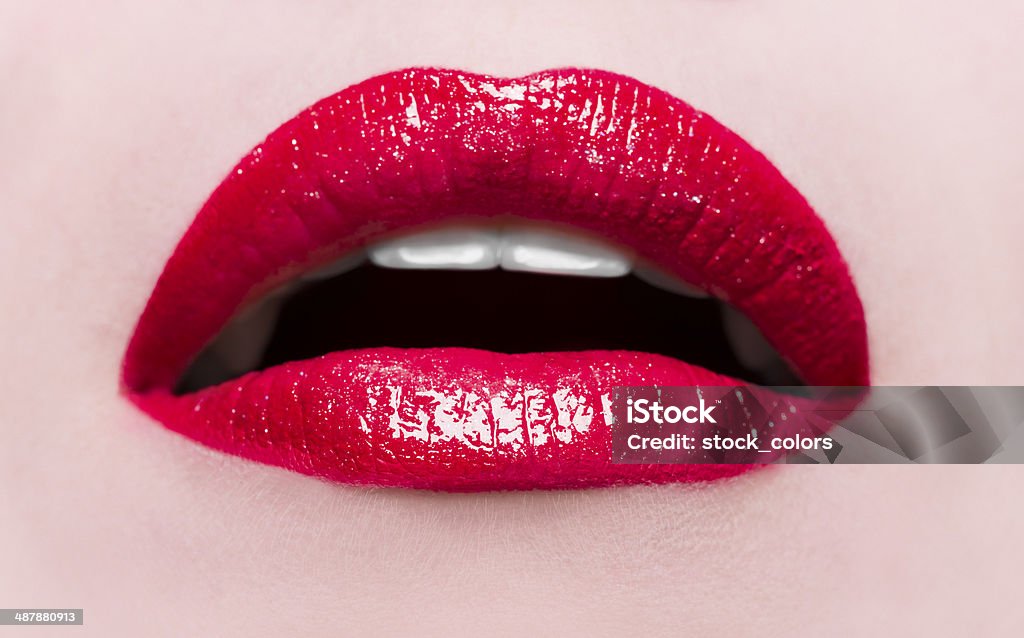 red lips woman seductive red lips, mouth open, macro shot. Human Lips Stock Photo
