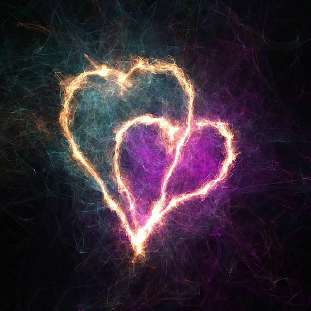 istock Glowing heart shape with sparkles on dark background 487898887