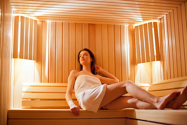 istock Young woman in sauna 487901079