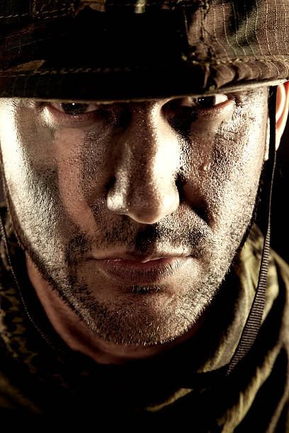 istock Serious soldier portrait 487901589