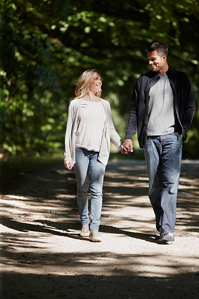istock Holding hands in the park and through life 487901803