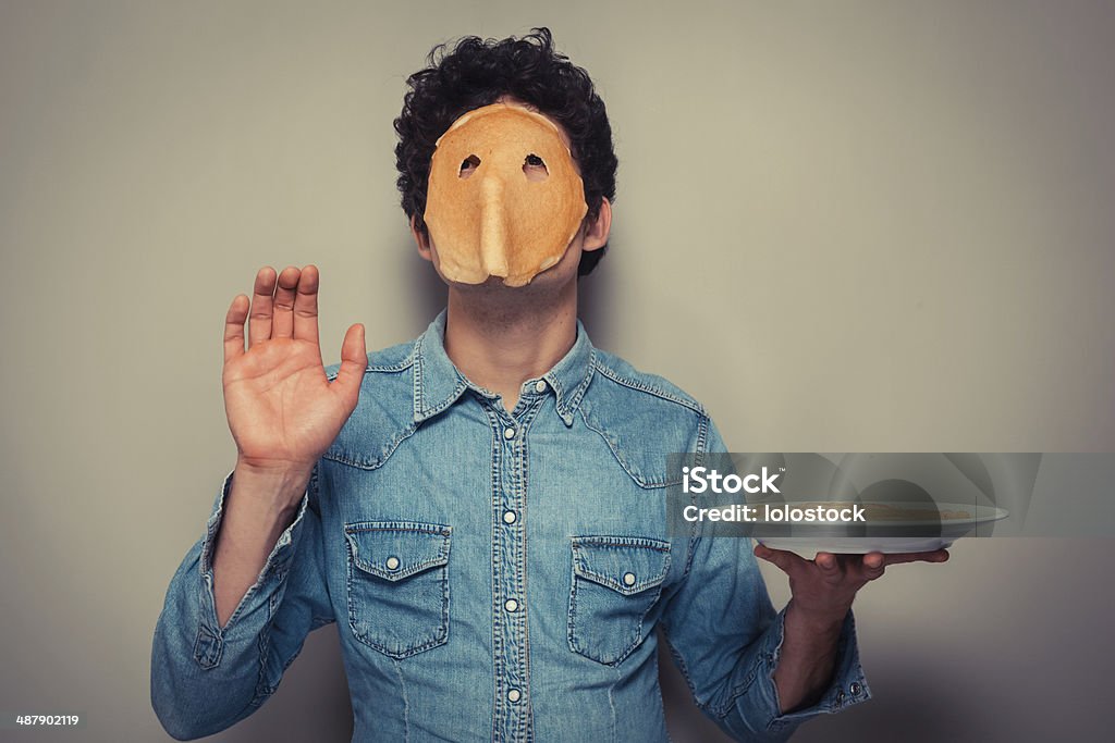 Mann mit Pfannkuchen auf seinem Gesicht - Lizenzfrei Eierkuchen-Speise Stock-Foto