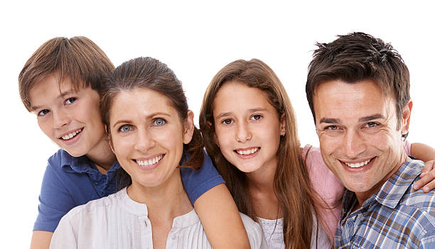 portrait of mother, father and their child together in studio