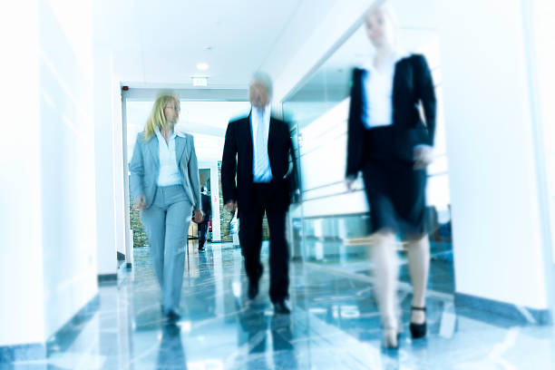 istock Businesspeople Walking in a Modern Interior 487904801