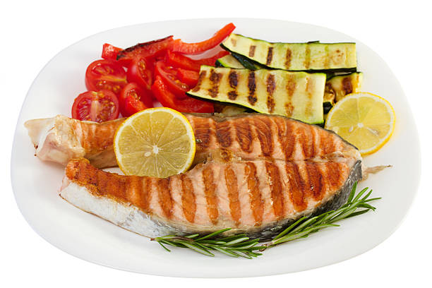 istock grilled fish with vegetables on the plate 487905379
