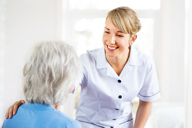 istock Nurse Comforting Senior Female Patient. 487905517