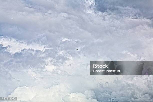 Parachutist In The Clouds Stock Photo - Download Image Now - 2015, Adult, Cloud - Sky