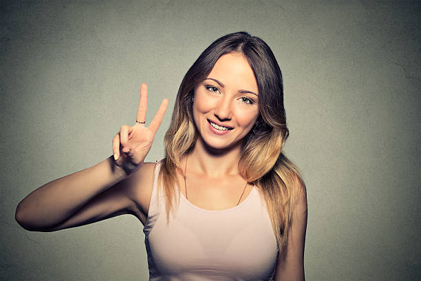 istock Young Girl With Victory Sign 487914070