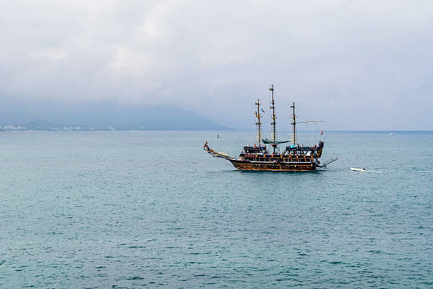 istock Sailing ship floating in the sea 487915706