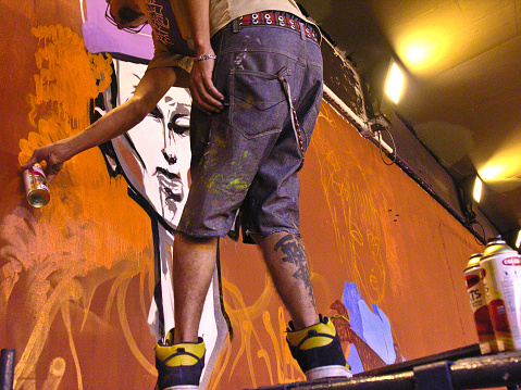 Sao Paulo, Brazil, Janeiro 27, 2007. Man makes a graffiti in the wall on Paulista Avenue tunnel, for the celebrations of Japanese Immigration to Brazil