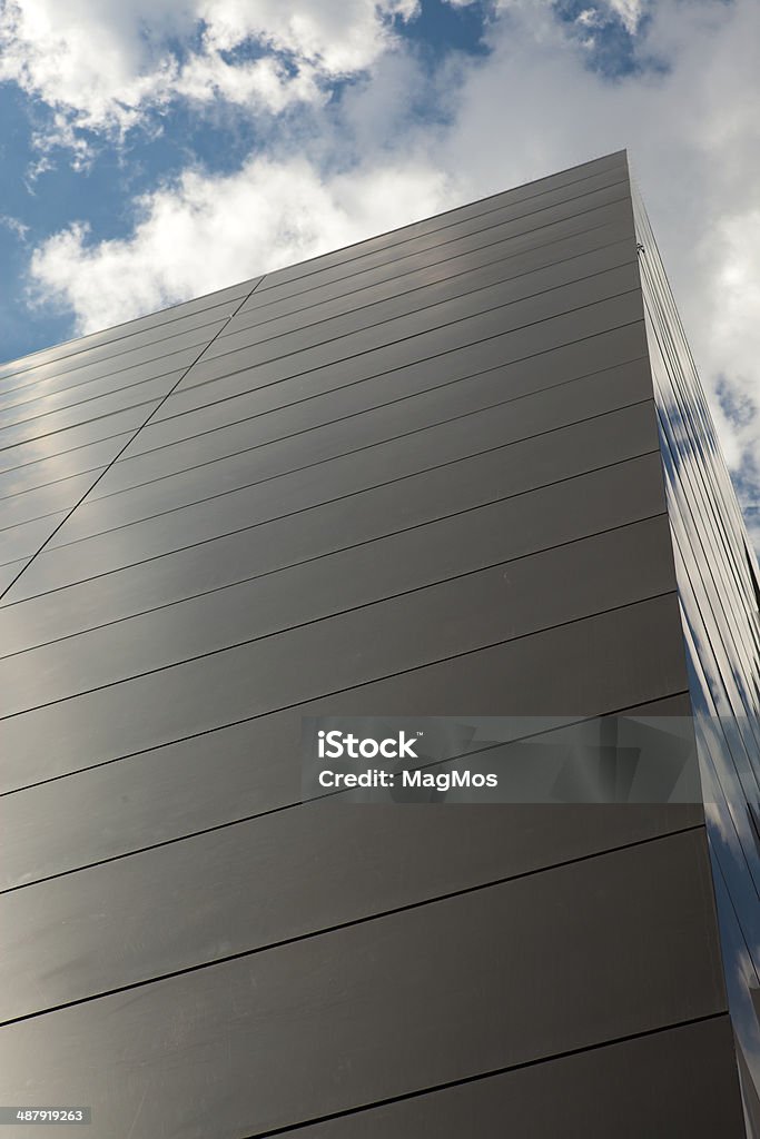 Wall of  modern building and blue sky Above Stock Photo