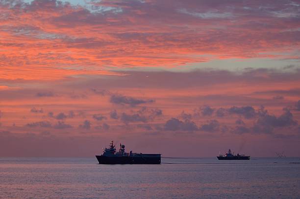 Seismic ships at Sundown stock photo