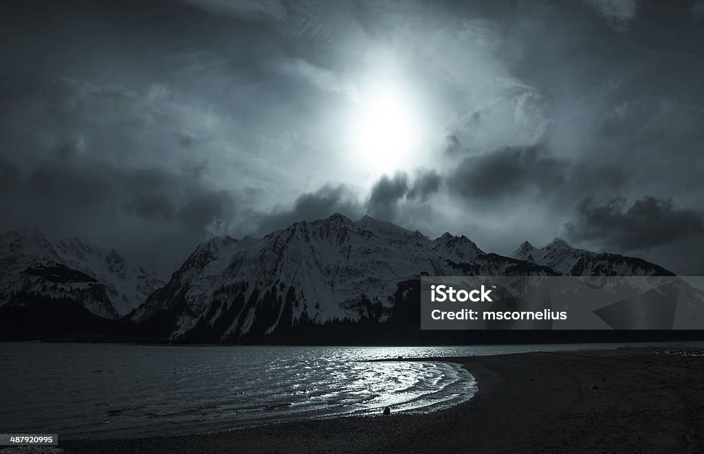 Mountains and Moonlight Moonlight over the mountains by the sea near Haines Alaska. Alaska - US State Stock Photo
