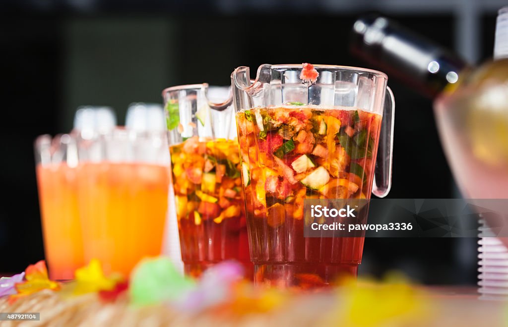 Jugs of alcohol punch Jugs containing alcoholic fresh fruit punch to be served for guests Carafe Stock Photo