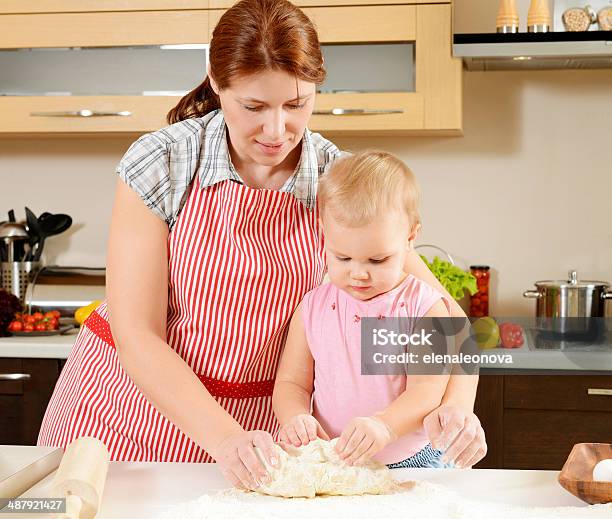 Family Cooks In The Kitchen Stock Photo - Download Image Now - Adult, Baby - Human Age, Baby Girls