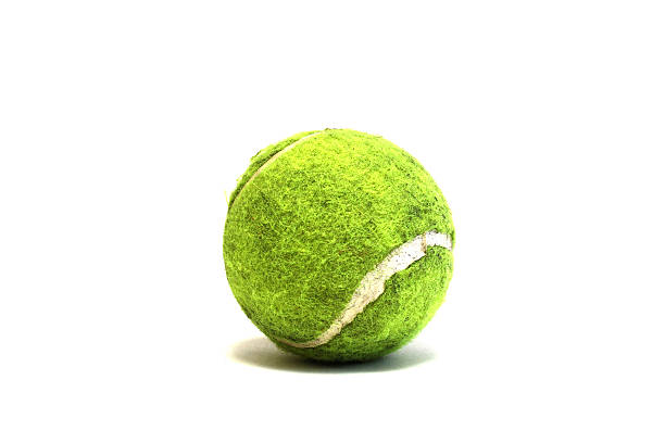 istock Bright tennis ball on white background 487921478