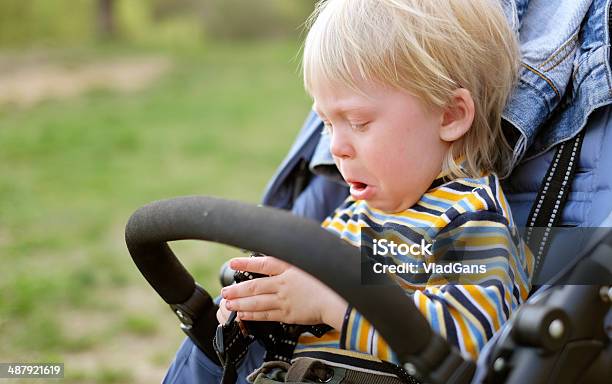 Boy Crying In Baby Carriage Stock Photo - Download Image Now - Baby Carriage, Displeased, 12-23 Months