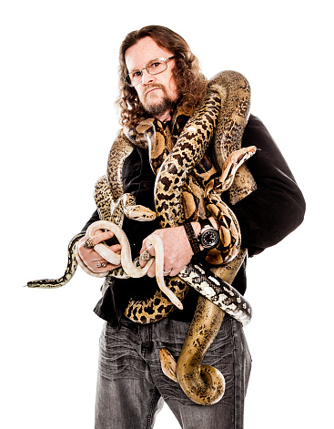 Man Holding Snakes