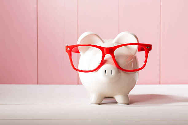 istock Piggy bank with red glasses 487923212
