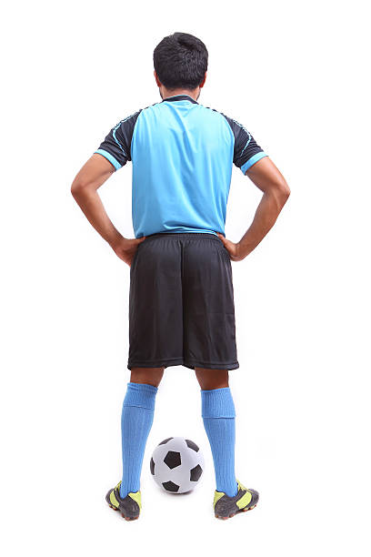 istock Young soccer football player on white 487923827