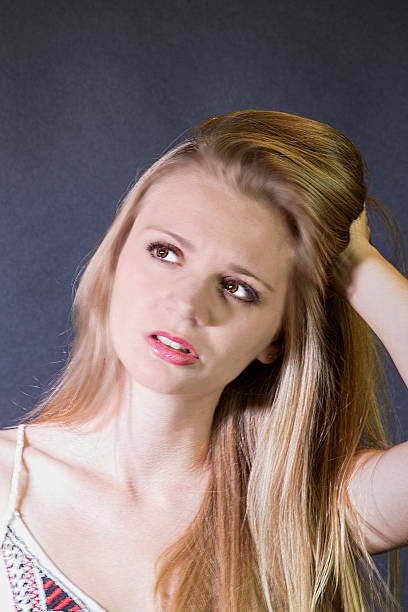 istock Puzzled Young Adult Female 487924534