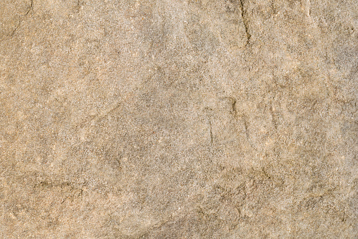 Detailed textured background of sandstone.